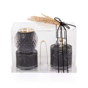 black decorated glass incense burner, bokhor storage box, and tong in an Acrylic box