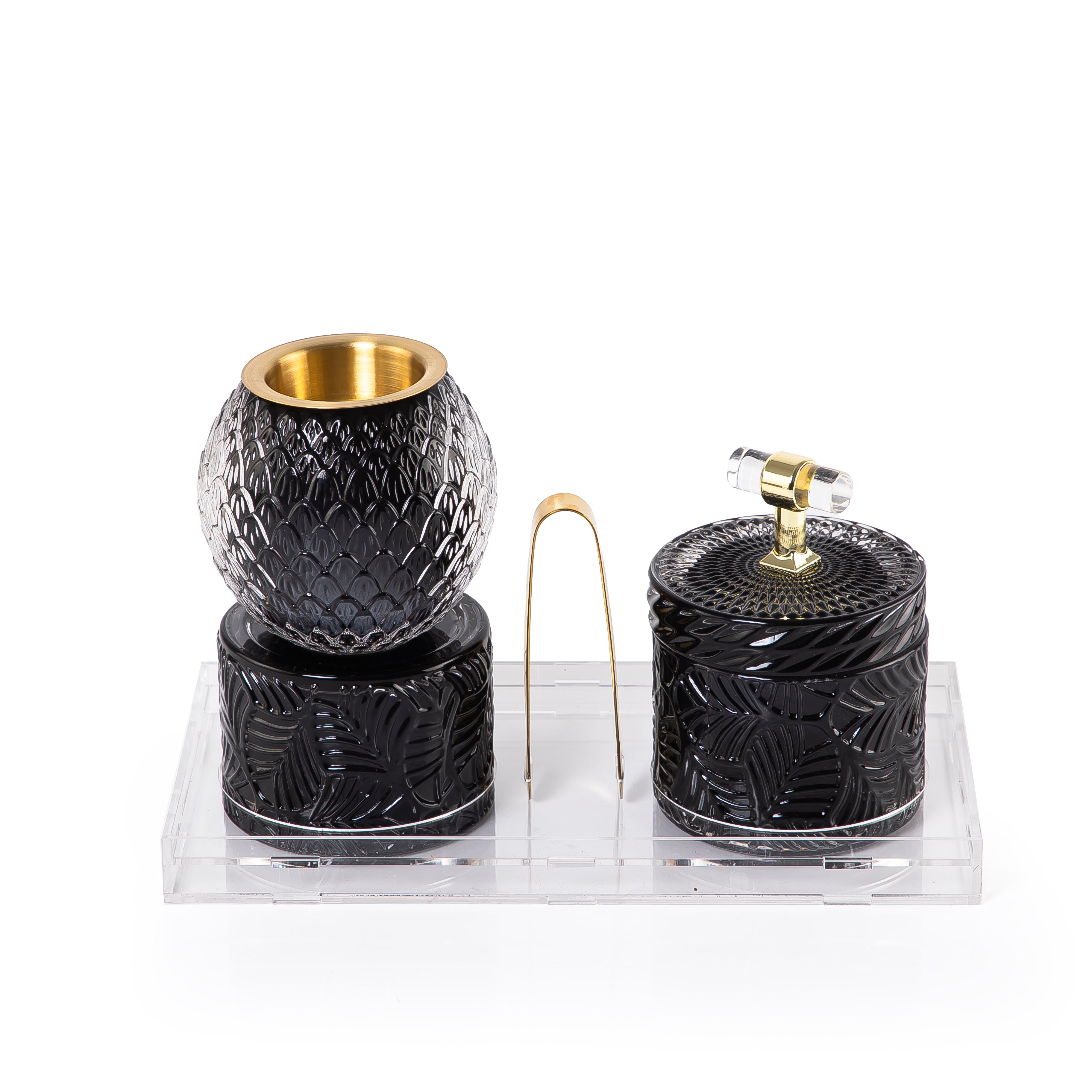 black decorated glass incense burner, bokhor storage box, and tong in an Acrylic box