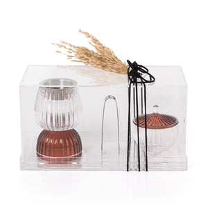 brown decorated glass incense burner, bokhor storage box, and tong in an Acrylic box