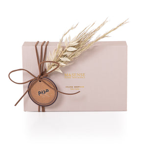 Rectangular decorated pink box with a customized name label