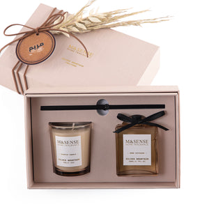 Rectangular decorated pink box with a customized name label, containing a diffuser, candle, and five sticks