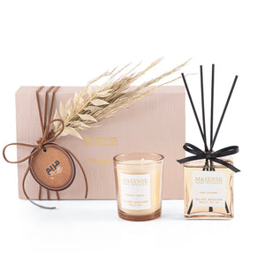 Rectangular decorated pink box with a customized name label, containing a diffuser, candle, and five sticks