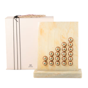 A beige/yellow Nespresso capsules stand