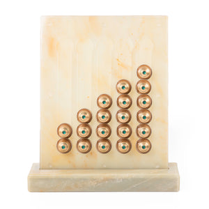 A beige/yellow Nespresso capsules stand