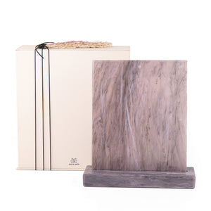 A purple Vertuo capsules stand