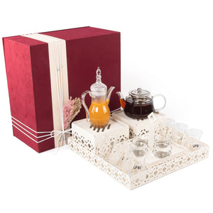 A beige metal set contains tray, two stands, 8 coffee glasses, 6 tea glasses, and metal coasters