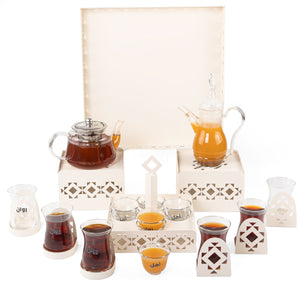 A beige metal set contains tray, two stands, 8 coffee glasses, 6 tea glasses, and metal coasters