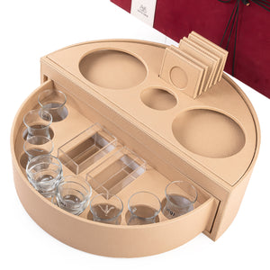 Beige leather set of circular stand contains six tea glasses, six coffee glasses, six coasters