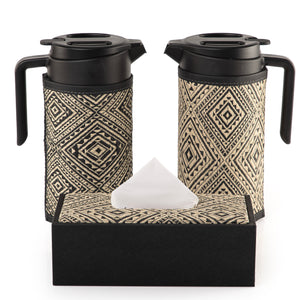 two thermoses with black fabric covers and tissue box