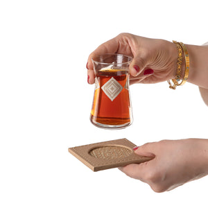 tea glass with beige coaster