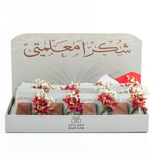 box of chocolate decorated with flower