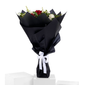 Elegant hand-tied bouquet featuring fresh deferent types of flowers -white ad red roses