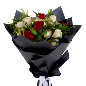 Elegant hand-tied bouquet featuring fresh deferent types of flowers -white ad red roses