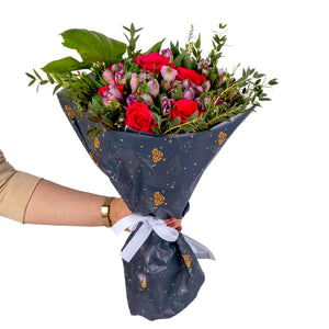 Elegant hand-tied bouquet featuring fresh deferent types of flowers