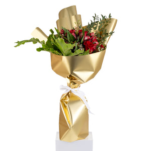 Elegant hand-tied bouquet featuring fresh red roses