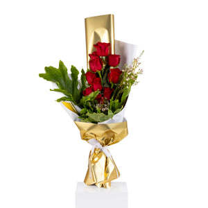 Elegant hand-tied bouquet featuring fresh red roses