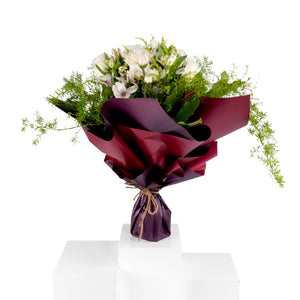 Elegant hand-tied bouquet featuring fresh deferent types of white flower