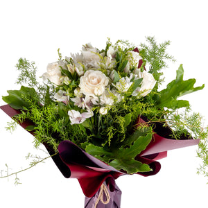 Elegant hand-tied bouquet featuring fresh deferent types of white flower