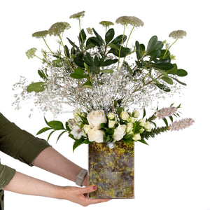 Elegant flower vase featuring fresh deferent types of white flowers