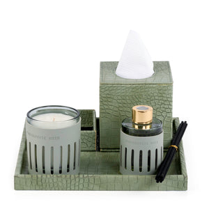 Green leather tray with matching tissue box, plate, candle, and diffuser