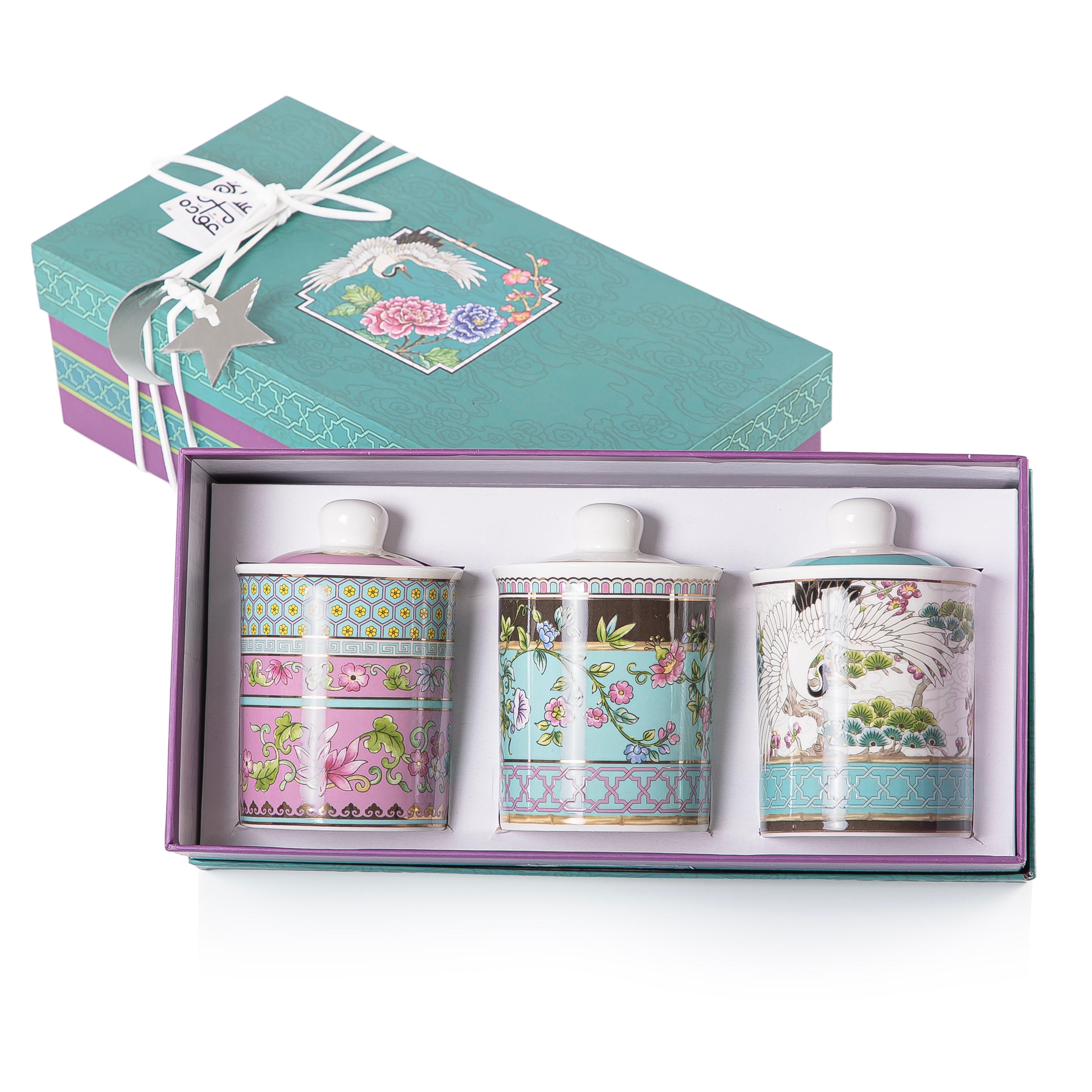 A set of three glasses decorated jars inside a gift box