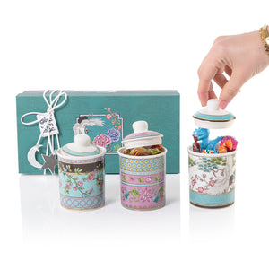 A set of three glasses decorated jars inside a gift box