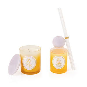 Yellow diffuser, candle, and five sticks