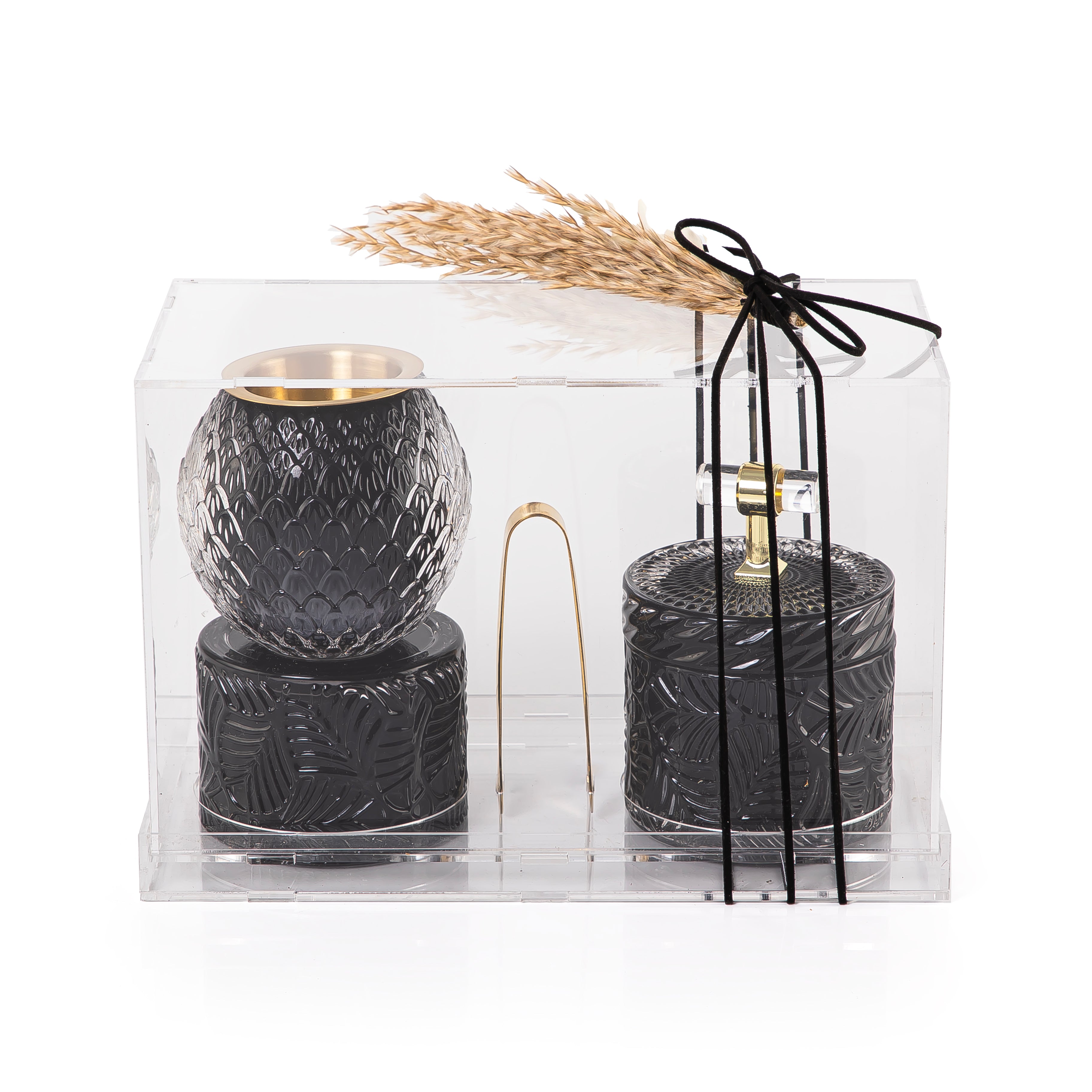 black decorated glass incense burner, bokhor storage box, and tong in an Acrylic box
