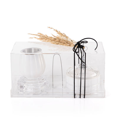white decorated glass incense burner, bokhor storage box, and tong in an Acrylic box