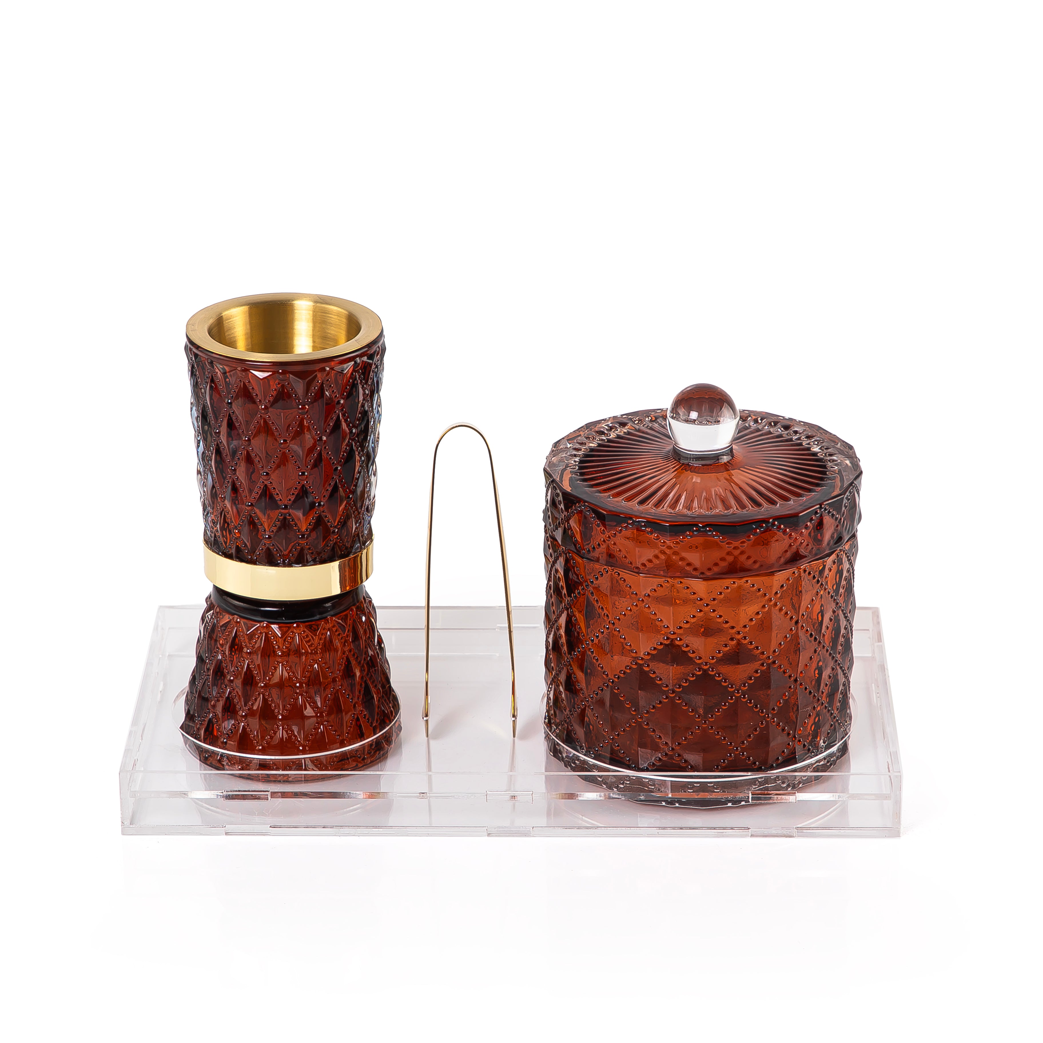 brown decorated glass incense burner, bokhor storage box, and tong in an Acrylic box