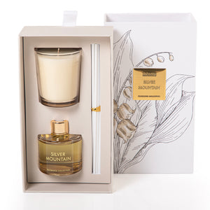 Rectangular decorated box with a customized name label, containing a diffuser, candle, and five sticks