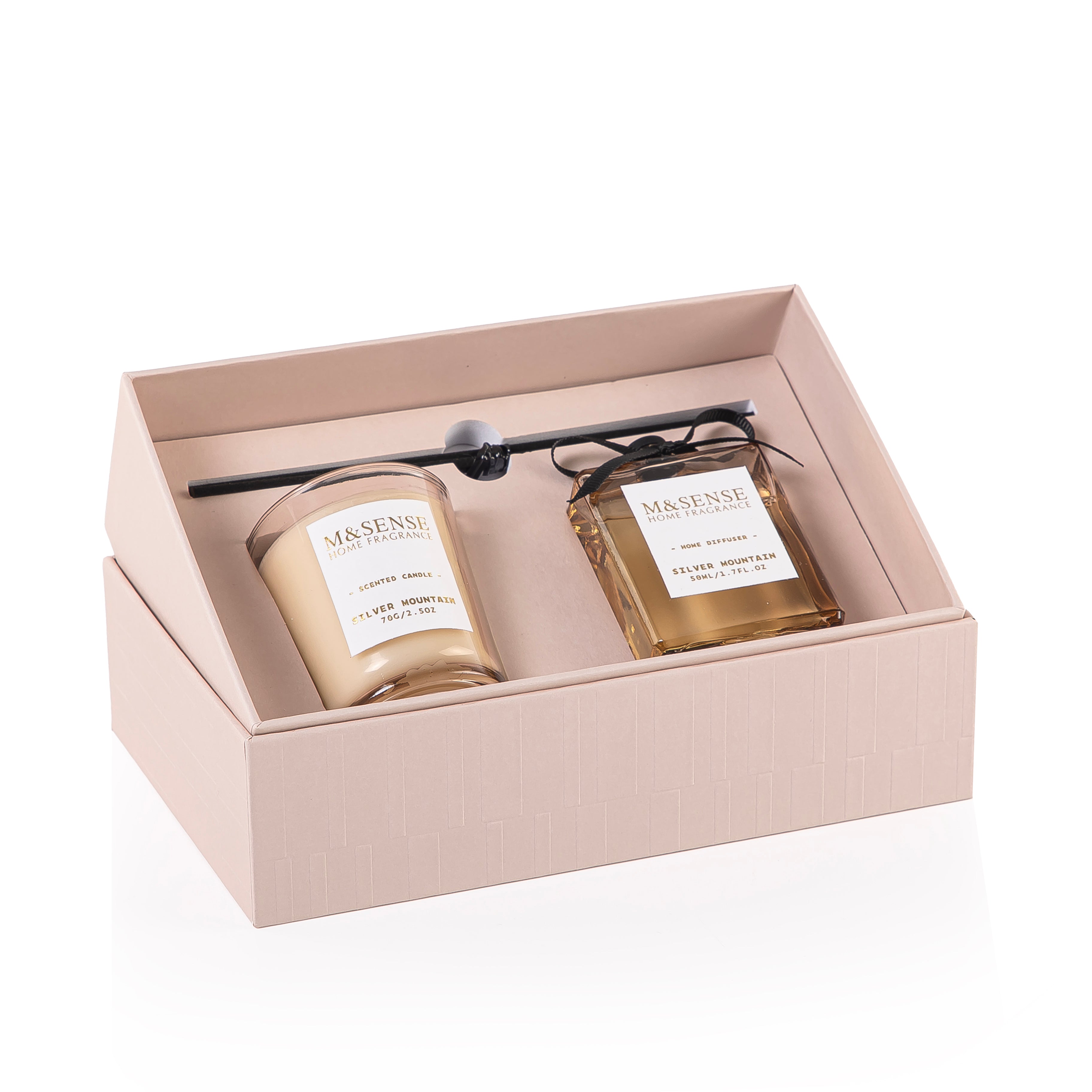 Rectangular decorated pink box with a customized name label, containing a diffuser, candle, and five sticks