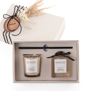 Rectangular decorated box with a customized name label, containing a diffuser, candle, and five sticks