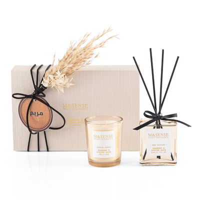 Rectangular decorated box with a customized name label, containing a diffuser, candle, and five sticks