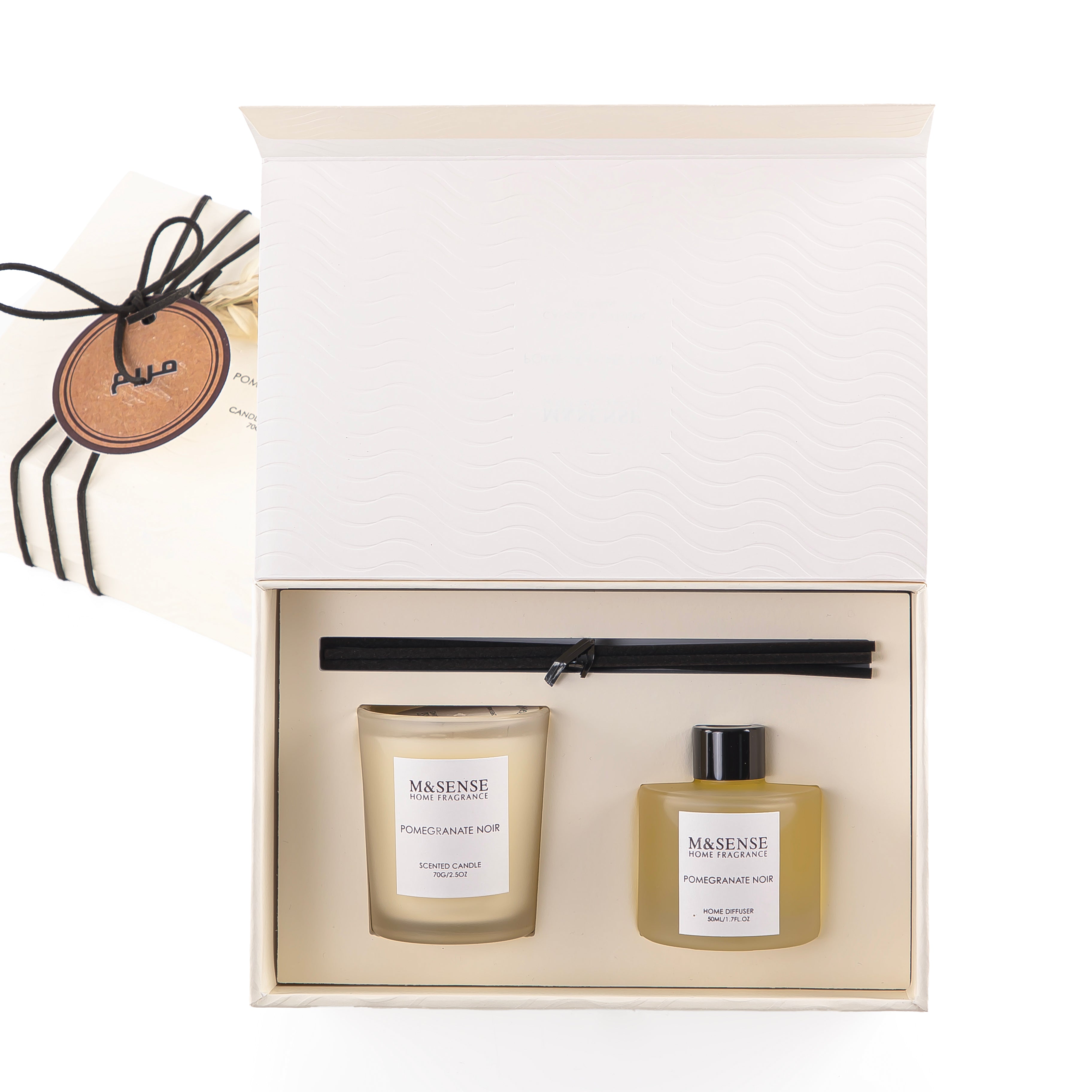 Rectangle yellow box with a customized name label contains Pomegranate Noir diffuser, candle, and five sticks