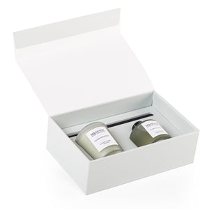 Rectangular decorated green box with a customized name label, containing a diffuser, candle, and five sticks