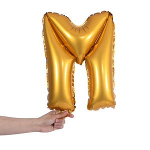 gold party balloon letter M