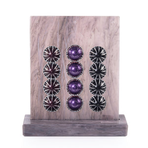 A purple Vertuo capsules stand