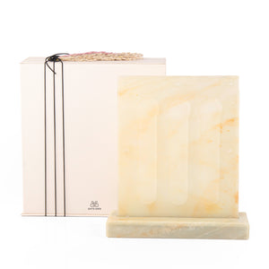 A yellow Vertuo capsules stand