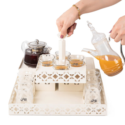 A beige metal set contains tray, two stands, 8 coffee glasses, 6 tea glasses, and metal coasters