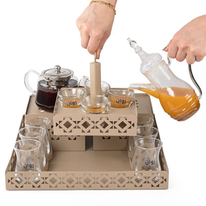 A beige metal set contains tray, two stands, 8 coffee glasses, 6 tea glasses, and metal coasters
