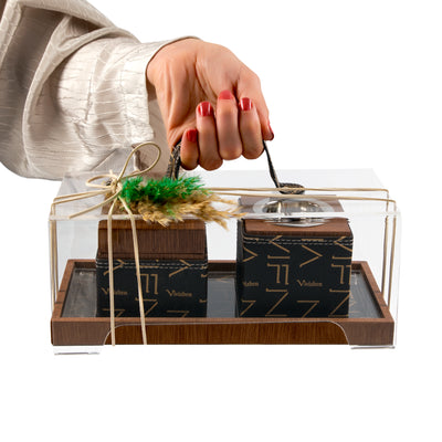 Brown tray with leather incense burner, and bakhor jar inside Acrylic box