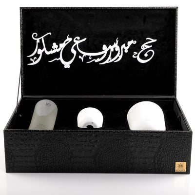black box contains diffuser, sticks, and candle decorated with customized sentence or name