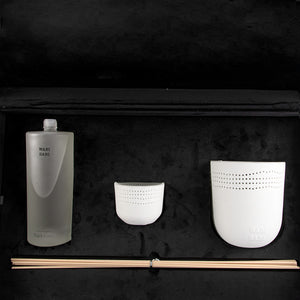 black box contains diffuser, sticks, and candle decorated with customized sentence or name