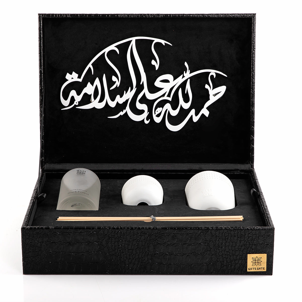 black box contains diffuser, sticks, and candle decorated with customized sentence or name