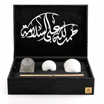 black box contains diffuser, sticks, and candle decorated with customized sentence or name