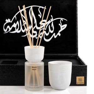 black box contains diffuser, sticks, and candle decorated with customized sentence or name