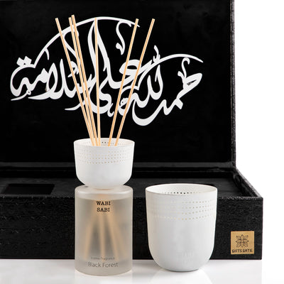 black box contains diffuser, sticks, and candle decorated with customized sentence or name