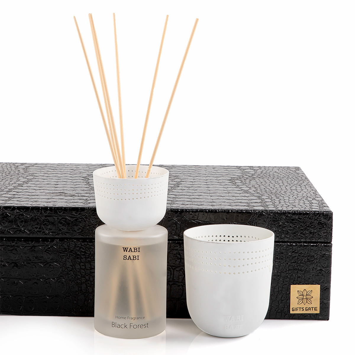 black box contains diffuser, sticks, and candle decorated with customized sentence or name