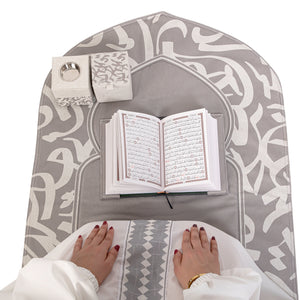 Grey set contains prayer carpet, matching prayer dress, Quran, incense burner, bakhor storage box